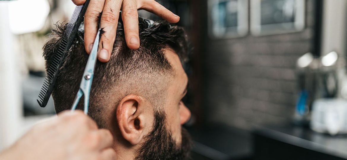 man haircut with a scissors