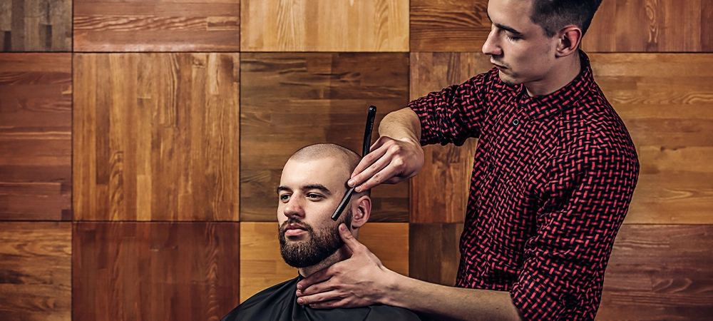 bald man beard cut in salon